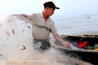 Folding his net .